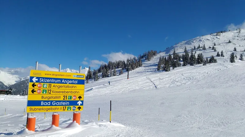 Sunny groomed slope in Bad Gastein, Austria, a region known for family ski resorts