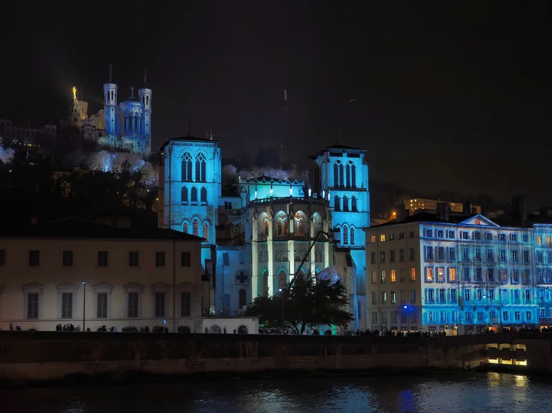 Lyon cathedral and Fourvière lit in blue during the Fête des Lumières, one of the best winter light festivals