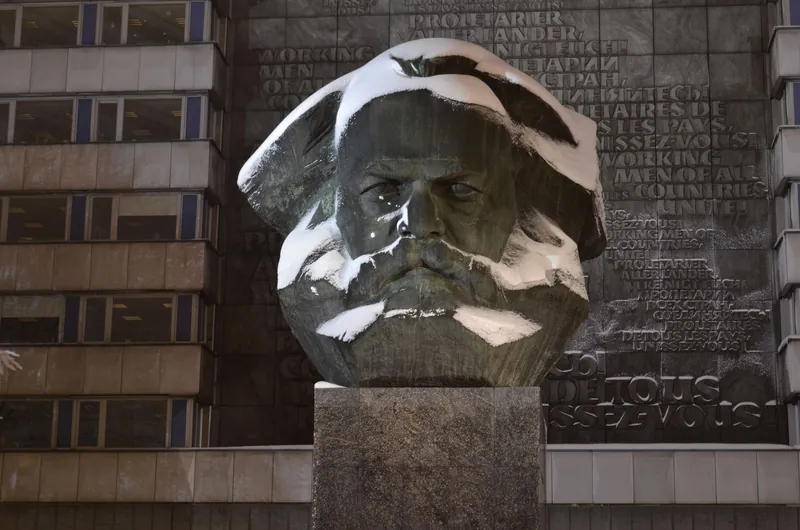 Snow-covered Karl Marx monument in Chemnitz, a fun photo stop for a European Capital of Culture with kids