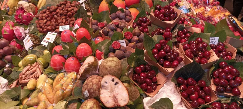 Cherries, figs and exotic fruit at La Boqueria in Barcelona, a favourite of food markets with kids