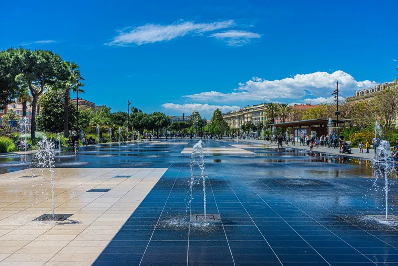 Water mirror and fountains on the Promenade du Paillon in Nice, close to beach playgrounds on the Riviera