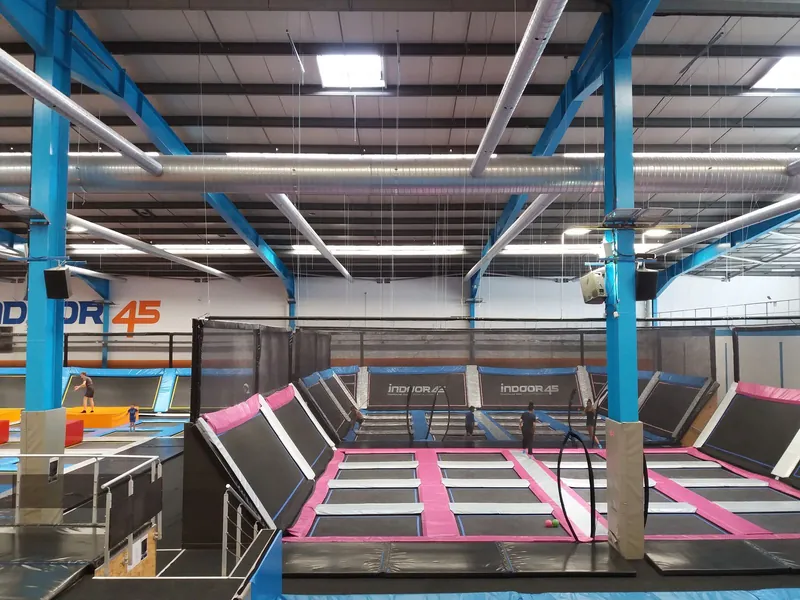 Colourful trampoline park with foam blocks and padded walls, a favourite kind of indoor play for autumn weekends