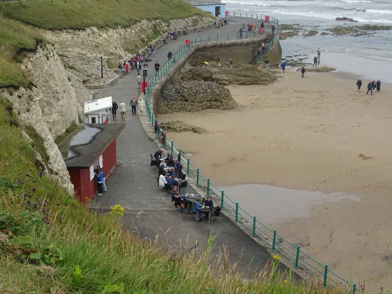 Seafront promenade, kiosk tables and sandy beach on the Sunderland coast, a great base for late summer breaks